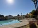 Inviting pool area with shaded seating and sun loungers at 1682 W Campbell Ave, Phoenix, AZ 85015