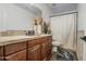 Bathroom boasts wood vanity, shower, and tile flooring at 17009 S 30Th Way, Phoenix, AZ 85048