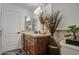 Bathroom boasts wood vanity, shower, and tile flooring at 17009 S 30Th Way, Phoenix, AZ 85048