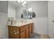 Bathroom with wood vanity and shower/tub combo at 17009 S 30Th Way, Phoenix, AZ 85048