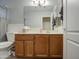 Bathroom with wood vanity and shower/tub combo at 17009 S 30Th Way, Phoenix, AZ 85048