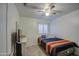 Cozy bedroom with striped bedding and ceiling fan at 17009 S 30Th Way, Phoenix, AZ 85048