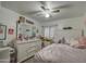 Charming bedroom with a comfortable bed and ceiling fan at 17009 S 30Th Way, Phoenix, AZ 85048