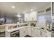 Modern kitchen with white cabinets, breakfast bar, and stainless steel appliances at 17009 S 30Th Way, Phoenix, AZ 85048