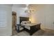 Main bedroom with bay window, ceiling fan, and dark wood furniture at 17009 S 30Th Way, Phoenix, AZ 85048