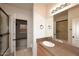 Bathroom with vanity, shower, and view into bedroom at 17020 E Kiwanis Dr # 102, Fountain Hills, AZ 85268