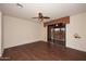 Bedroom with dark wood floors and access to a patio at 17020 E Kiwanis Dr # 102, Fountain Hills, AZ 85268