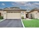 Tan stucco home with tile roof, 2-car garage, & landscaped front yard at 17020 E Kiwanis Dr # 102, Fountain Hills, AZ 85268