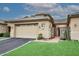 Tan stucco home with tile roof, 2-car garage, & landscaped front yard at 17020 E Kiwanis Dr # 102, Fountain Hills, AZ 85268