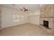 Living room with fireplace, tile floors, and large window at 17020 E Kiwanis Dr # 102, Fountain Hills, AZ 85268