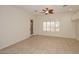 Living room with tile floors, ceiling fan, and window shutters at 17020 E Kiwanis Dr # 102, Fountain Hills, AZ 85268