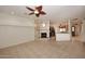 Bright living room features a fireplace and tile flooring, open to kitchen at 17020 E Kiwanis Dr # 102, Fountain Hills, AZ 85268