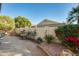 Landscaped backyard with fountain and brick walkway at 17129 N Silver Path, Surprise, AZ 85374