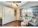 Bright bedroom featuring a Murphy bed and two comfy armchairs at 17129 N Silver Path, Surprise, AZ 85374