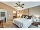 Bright bedroom with a king-size bed and ensuite bathroom at 17129 N Silver Path, Surprise, AZ 85374