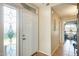 Clean entryway with tiled floors and stained glass window at 17129 N Silver Path, Surprise, AZ 85374