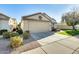 Single-story house with attached garage and landscaped front yard at 17129 N Silver Path, Surprise, AZ 85374