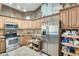 Modern kitchen with ample cabinetry and pull-out shelving at 17129 N Silver Path, Surprise, AZ 85374