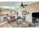 Cozy living room features a brown leather couch and a fireplace at 17129 N Silver Path, Surprise, AZ 85374