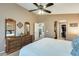 Main bedroom with walk-in closet and dresser at 17129 N Silver Path, Surprise, AZ 85374