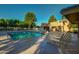 Inviting community pool with lounge chairs and patio at 17129 N Silver Path, Surprise, AZ 85374