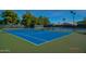 Two well-maintained tennis courts with green surrounding at 17129 N Silver Path, Surprise, AZ 85374