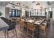 Elegant dining room with wooden tables and leather chairs at 17219 W Vacaville St, Surprise, AZ 85388