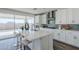 Kitchen featuring a center island, stone countertops, and stainless steel appliances at 17219 W Vacaville St, Surprise, AZ 85388