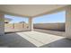 Covered patio with concrete flooring and clear view of the gravel yard at 17219 W Vacaville St, Surprise, AZ 85388