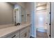 Modern bathroom with white vanity, matte black fixtures, and bathtub at 17380 W Carlisle Dr, Surprise, AZ 85388