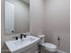 Simple bathroom with a single sink vanity and toilet at 17380 W Carlisle Dr, Surprise, AZ 85388