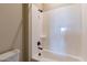 Clean bathroom with white tub/shower and matte black fixtures at 17380 W Carlisle Dr, Surprise, AZ 85388