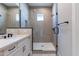 Bathroom with a double vanity and a large walk-in shower at 17380 W Carlisle Dr, Surprise, AZ 85388