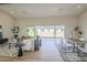 Open-concept living space with a sliding glass door to the patio and a view of the backyard at 17380 W Carlisle Dr, Surprise, AZ 85388