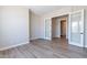 Bright home office features wood-look tile floors and access to a full bathroom at 17380 W Carlisle Dr, Surprise, AZ 85388