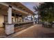 Outdoor bar and lounge area with seating and brick feature wall at 17380 W Carlisle Dr, Surprise, AZ 85388