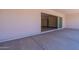 Covered patio with sliding glass doors opening to the interior at 17380 W Carlisle Dr, Surprise, AZ 85388