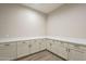 Spacious storage room with countertops and cabinetry for organization and functionality at 17380 W Carlisle Dr, Surprise, AZ 85388