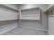 Large walk-in closet with ample shelving and hanging rods at 17380 W Carlisle Dr, Surprise, AZ 85388