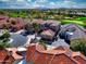 Stunning aerial view of a home with red tile roof in a golf course community with mountain views at 17459 N 79Th St, Scottsdale, AZ 85255