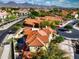 Aerial view of beautiful red-tiled home in a community with mountain views at 17459 N 79Th St, Scottsdale, AZ 85255