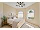 Bright bedroom with queen bed, ceiling fan and arched windows at 17459 N 79Th St, Scottsdale, AZ 85255