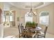 Elegant dining room featuring a round table and a beautiful chandelier at 17459 N 79Th St, Scottsdale, AZ 85255