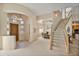 Open entryway showcasing a dining area and elegant staircase at 17459 N 79Th St, Scottsdale, AZ 85255