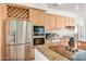 Modern kitchen with stainless steel appliances and wine storage at 17459 N 79Th St, Scottsdale, AZ 85255