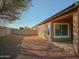 Backyard view of house with gravel and block wall at 1933 S Peppertree Dr, Gilbert, AZ 85295