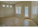 Bright dining area with tile floors and backyard access at 1933 S Peppertree Dr, Gilbert, AZ 85295