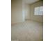 Living room with carpet and interior door at 1933 S Peppertree Dr, Gilbert, AZ 85295