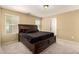 Spacious bedroom with a large bed, neutral wall colors, and plenty of natural light at 1940 N 78Th Gln, Phoenix, AZ 85035