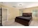 Main bedroom with a large bed and access to a loft area at 1940 N 78Th Gln, Phoenix, AZ 85035